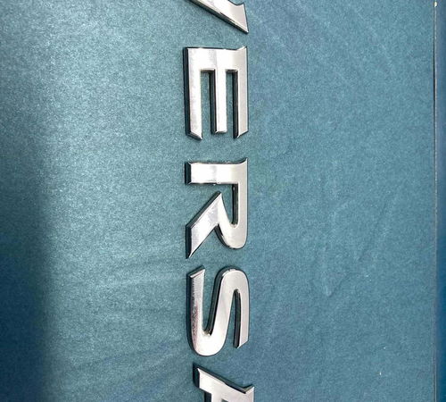 Emblema Escrita Capo Ts. Nissan Versa  2016