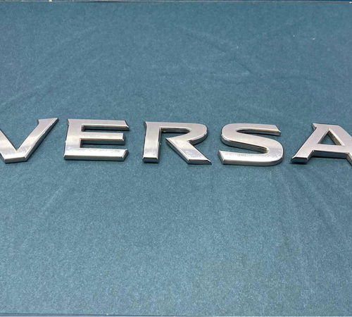 Emblema Escrita Capo Ts. Nissan Versa  2...